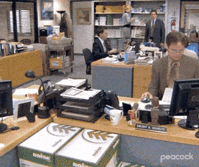 Animated gif from The Office showing Dwight, Jim, and Michael at their desks in the Dunder Mifflin office